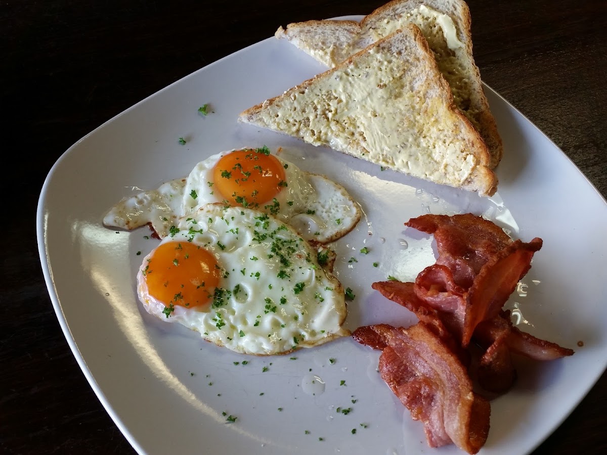 Bacon, fried eggs and toast at The Grindhouse Cafe